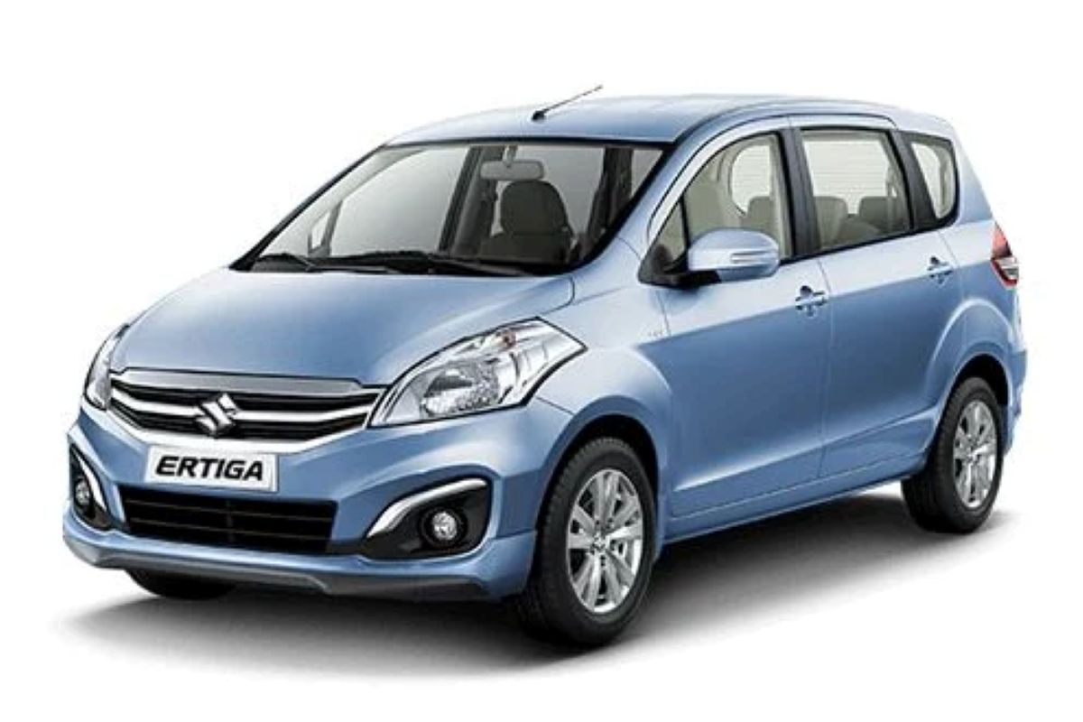 Maruti Ertiga 2025 model in white color – 7-seater MPV parked outdoors showcasing modern design.